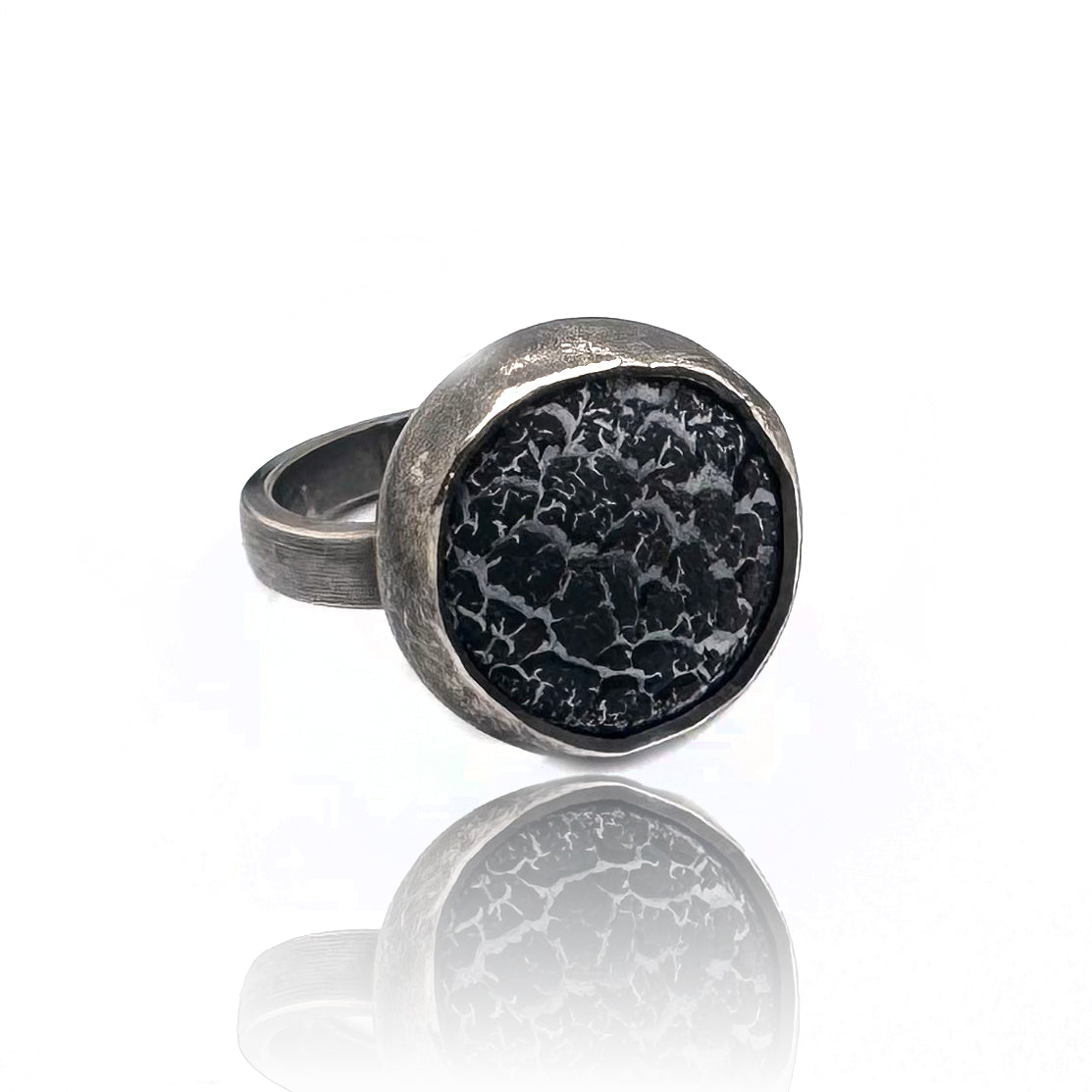 silver ring with black and gray texture