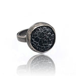 silver ring with black and gray texture