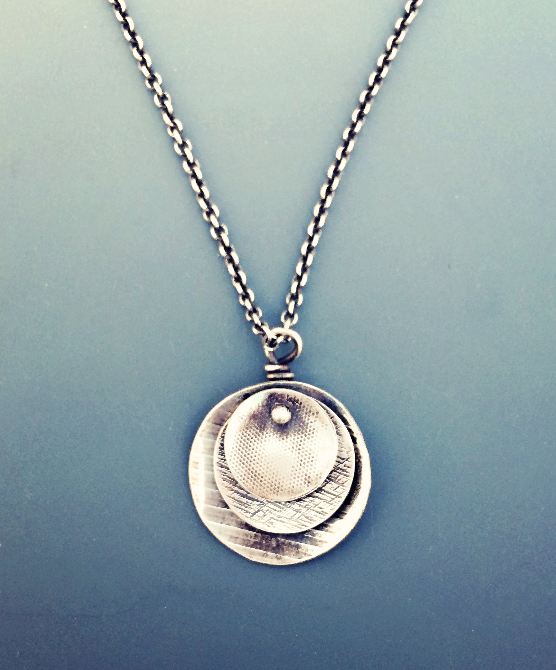 round sterling pendant